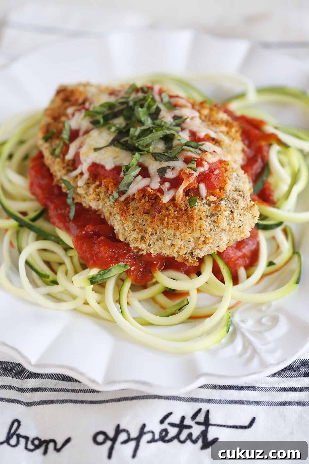 Baked Chicken Parmesan Over Zucchini Noodles Bowl 5 This recipe for Baked Chicken Parmesan with Zucchini Noodles is healthy, delicious and can easily be made in just 30 minutes or less!