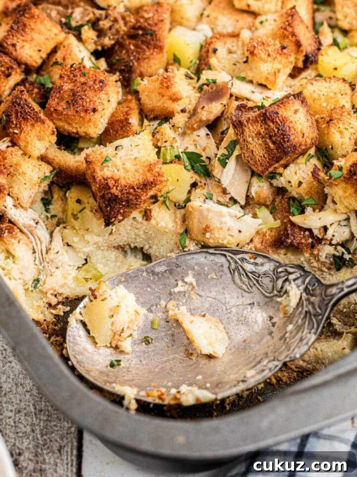 A cropped square image of Amish turkey stuffing recipe, with a spoon resting.