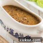 Close up of southern giblet gravy in a gravy boat.