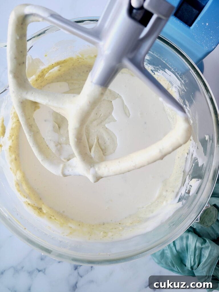 Adding heavy cream into cheesecake batter