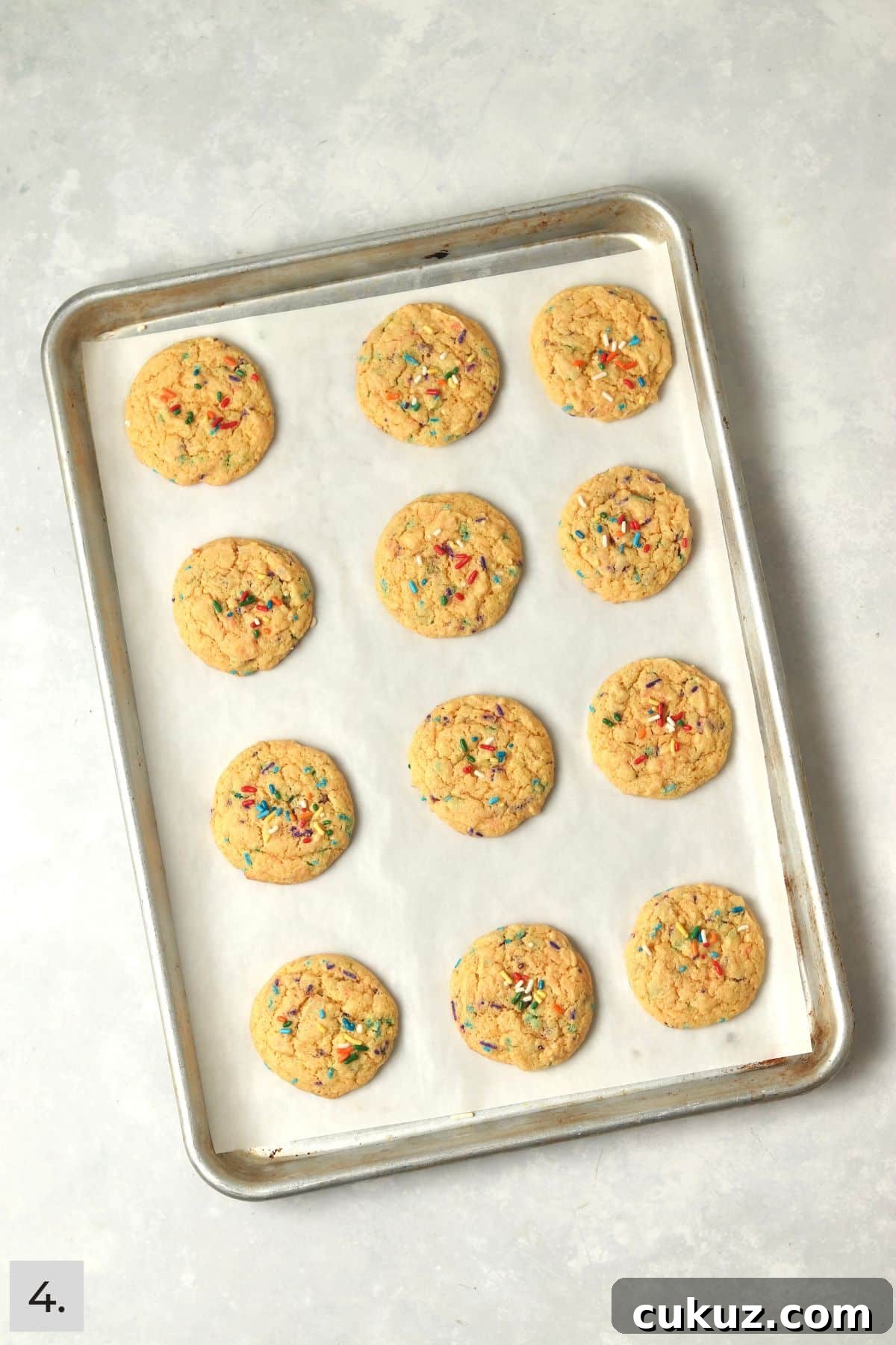 3-Ingredient Funfetti Cake Mix Cookies Recipe 7 Baked funfetti cake mix cookies on a sheet pan.