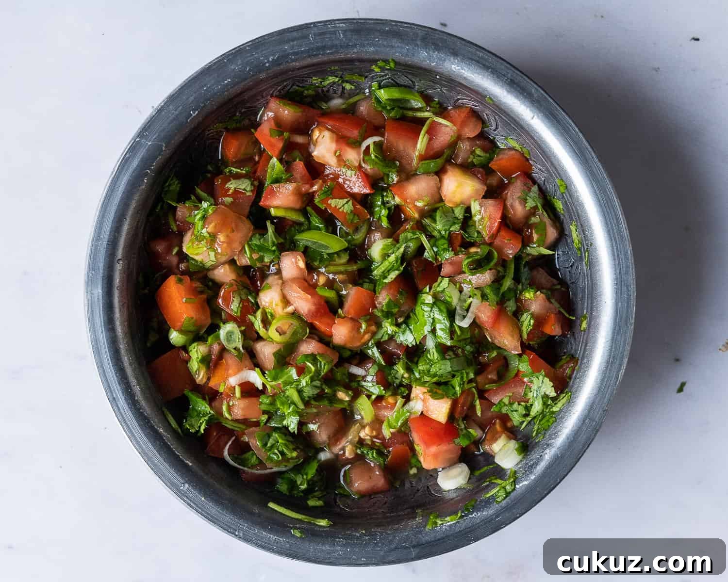 A bowl of tomato lime salsa.
