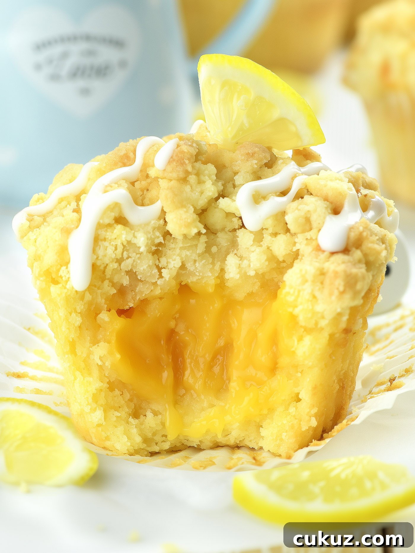 lemon curd muffin with creamy lemon filling and glaze on top