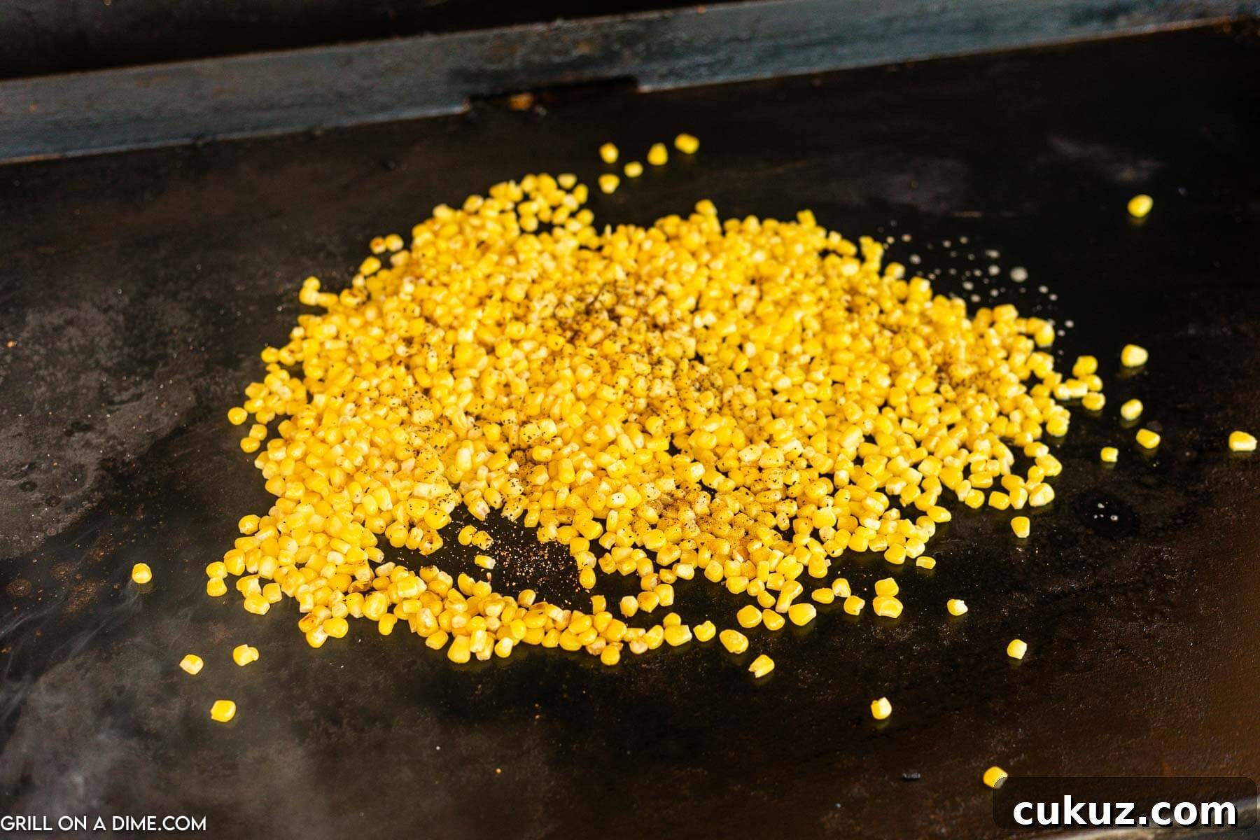 Placing corn on the griddle.