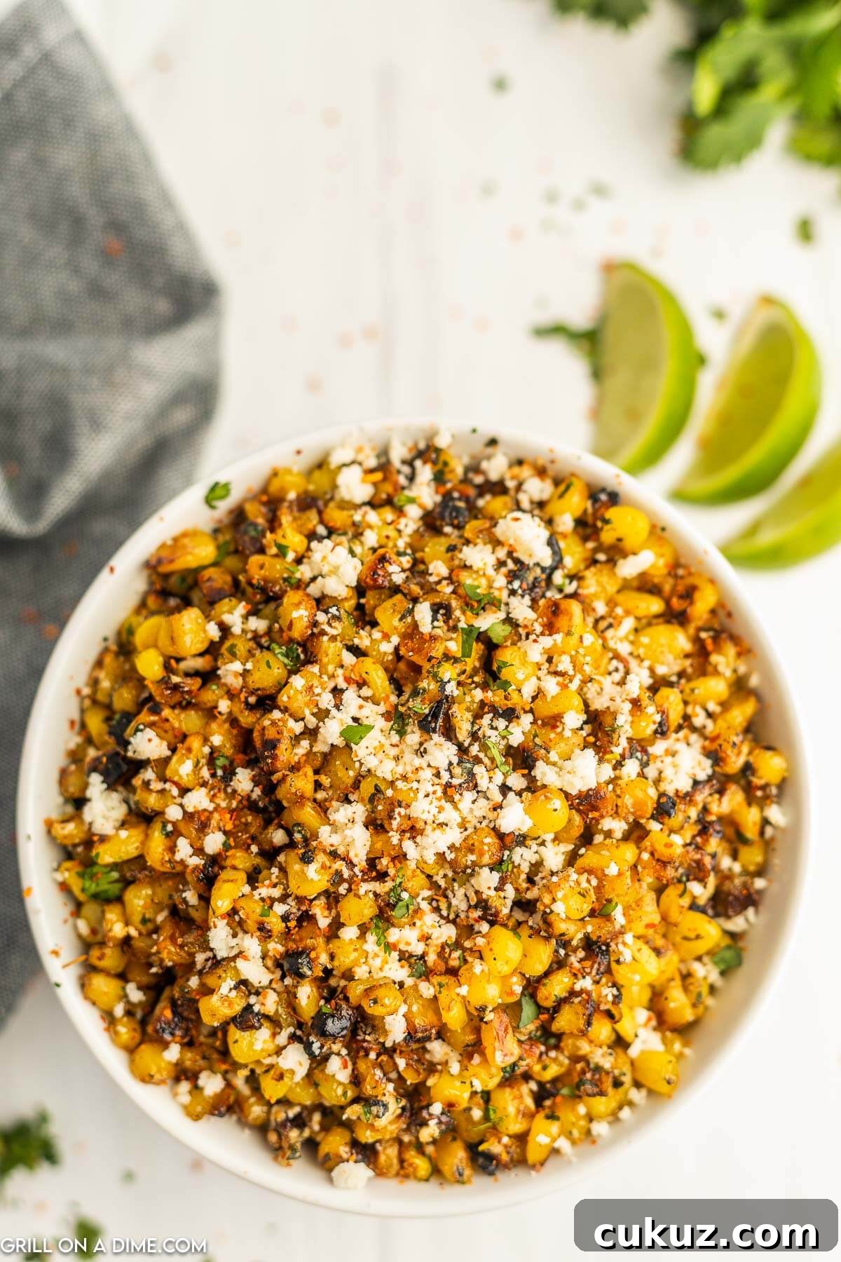 Street Corn topped with Cojita Cheese in a bowl.
