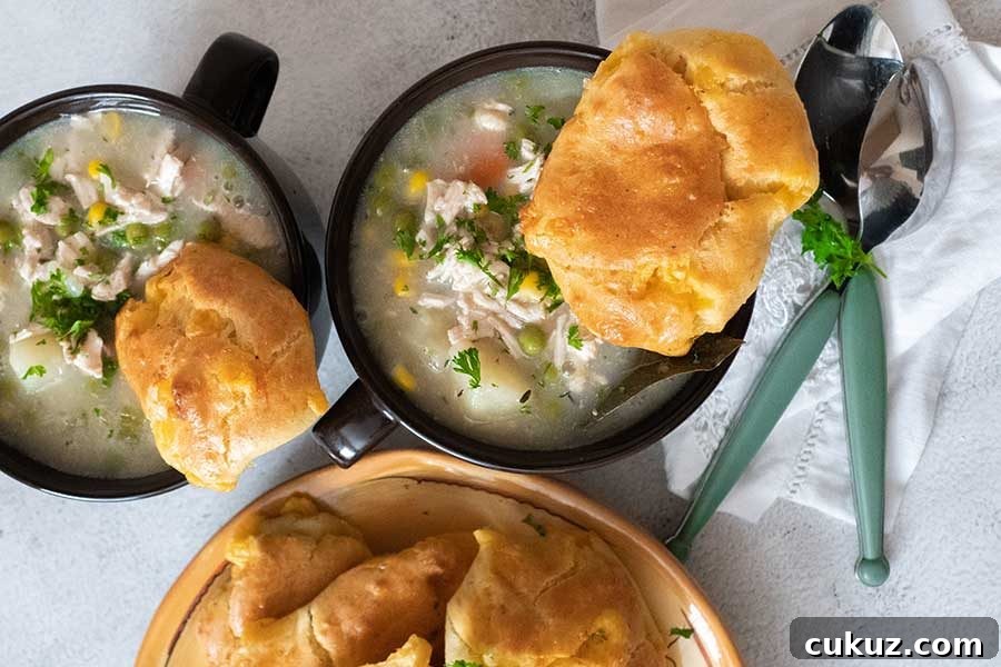 2 cups filled with creamy soup topped with biscuit for dinner