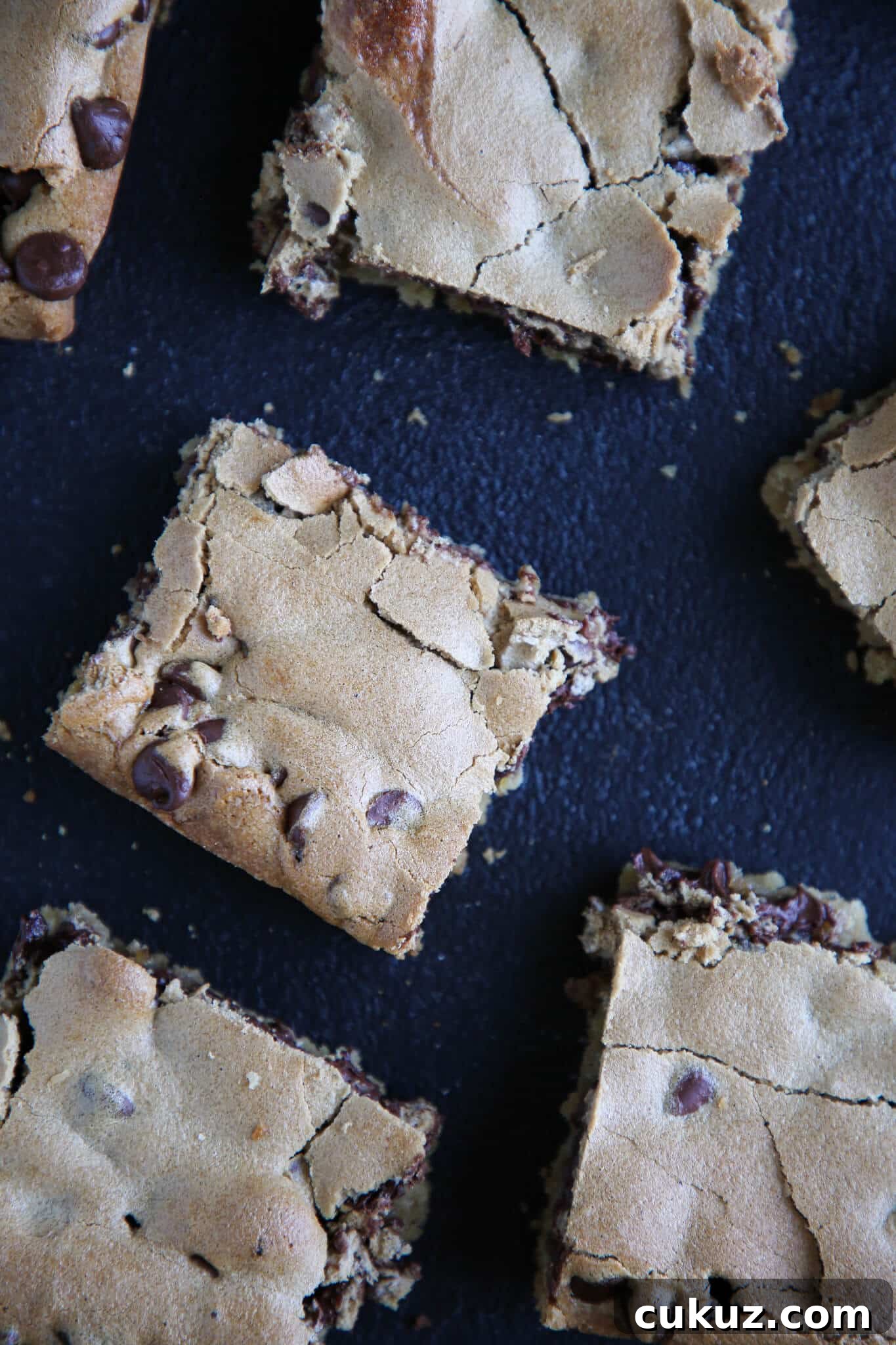 Chocolate Halfway Bars Recipe: Fudgy No-Bake Chocolate Bars 4 Chocolate Halfway Bars sliced on black surface