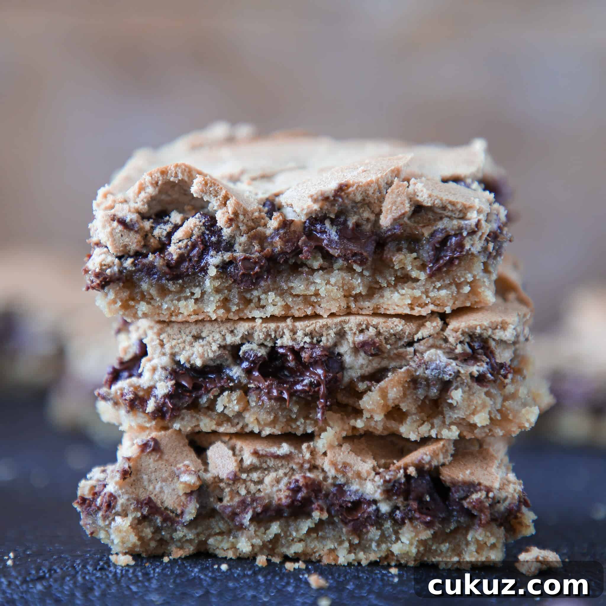 Chocolate Halfway Bars Recipe: Fudgy No-Bake Chocolate Bars 7 Chocolate Halfway Bars stacked wooden background