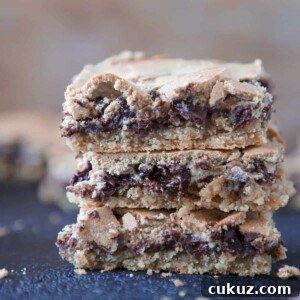 Chocolate Halfway Bars Recipe: Fudgy No-Bake Chocolate Bars 8 Chocolate Halfway Bars stacked melted chocolate.