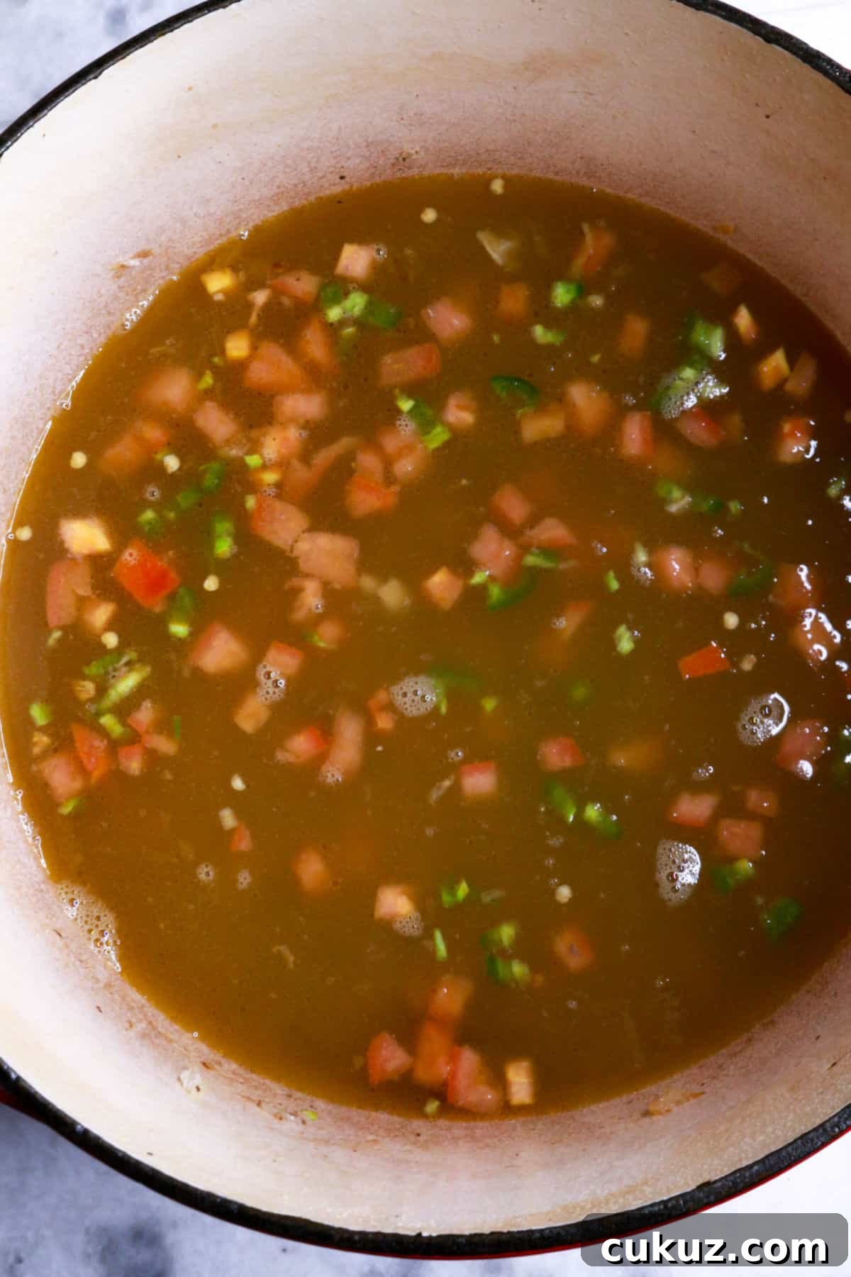 Mexican ground beef stew simmering in a pot