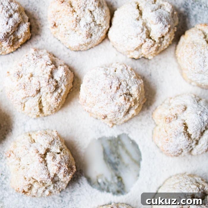 Freshly baked keto amaretti with powdered sugar