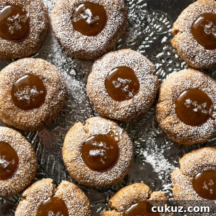 Gluten free & keto salted caramel thumbprint cookies with flakey sea salt