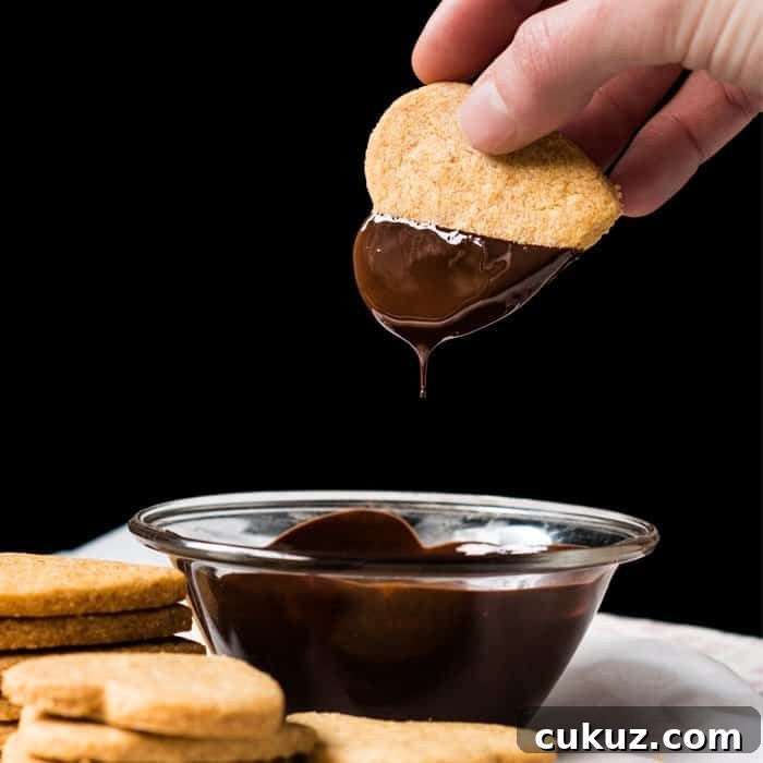 Dunking Keto Shortbread Cookies in Chocolate