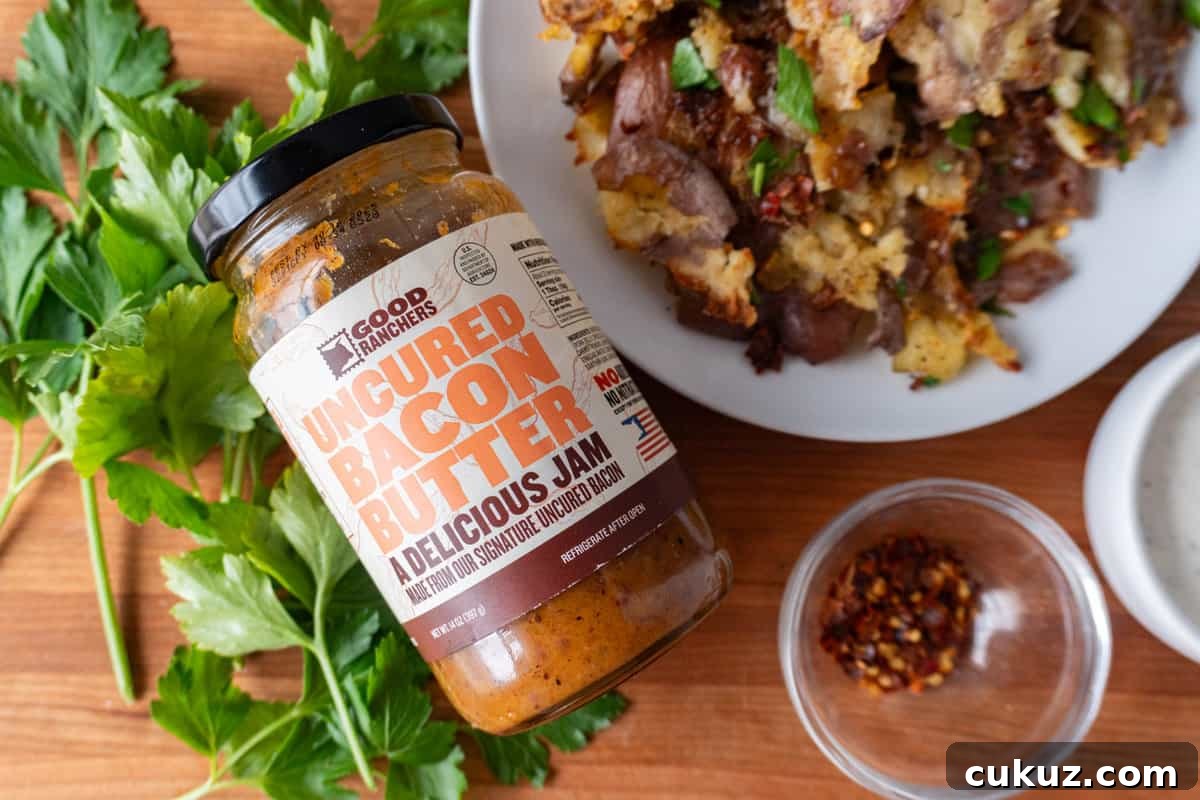 close up of bacon jam jar and baked potatoes