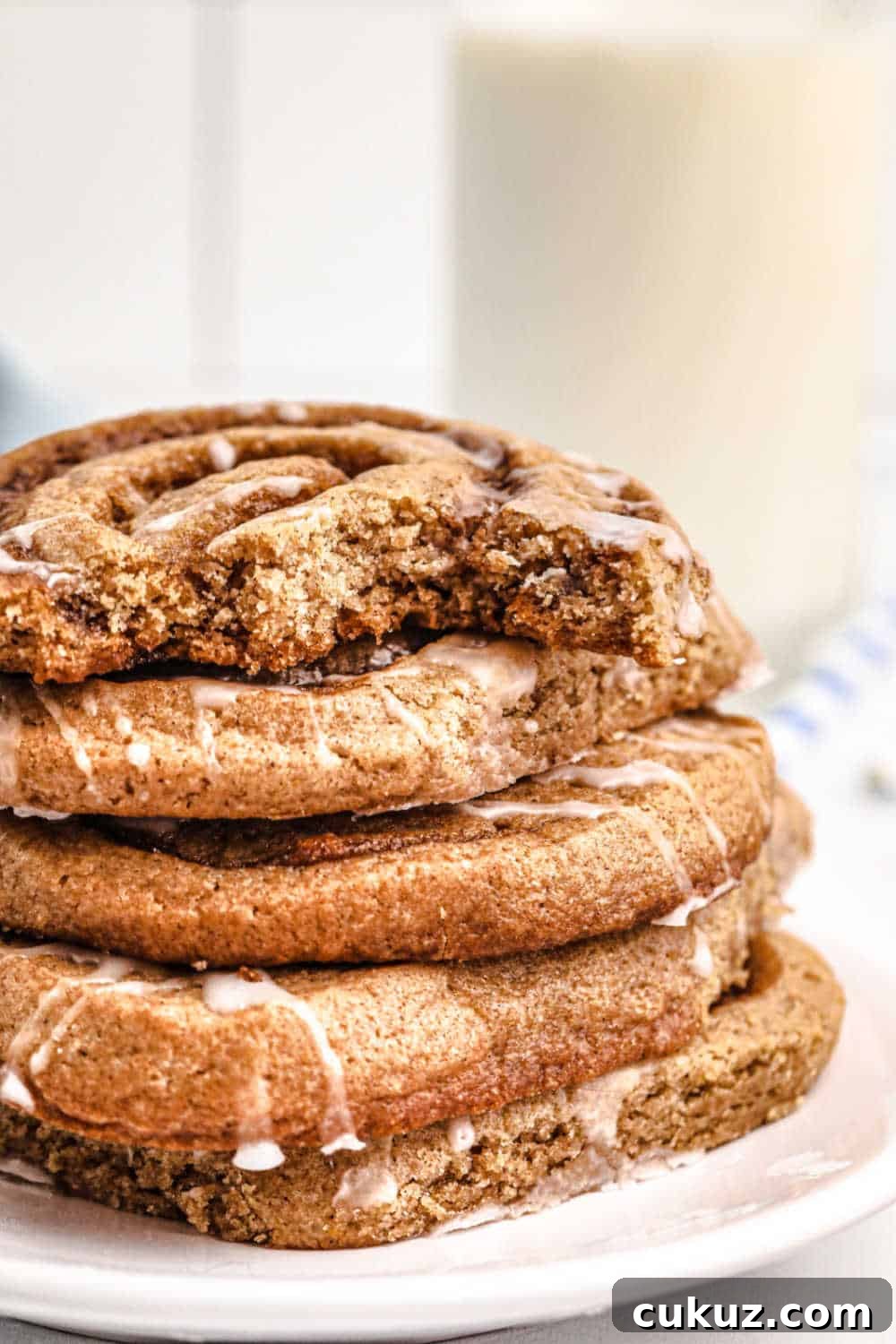 A stack of cinnamon roll cookies on a plate