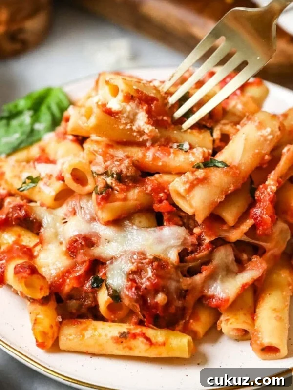 Plate with a serving of baked ziti.