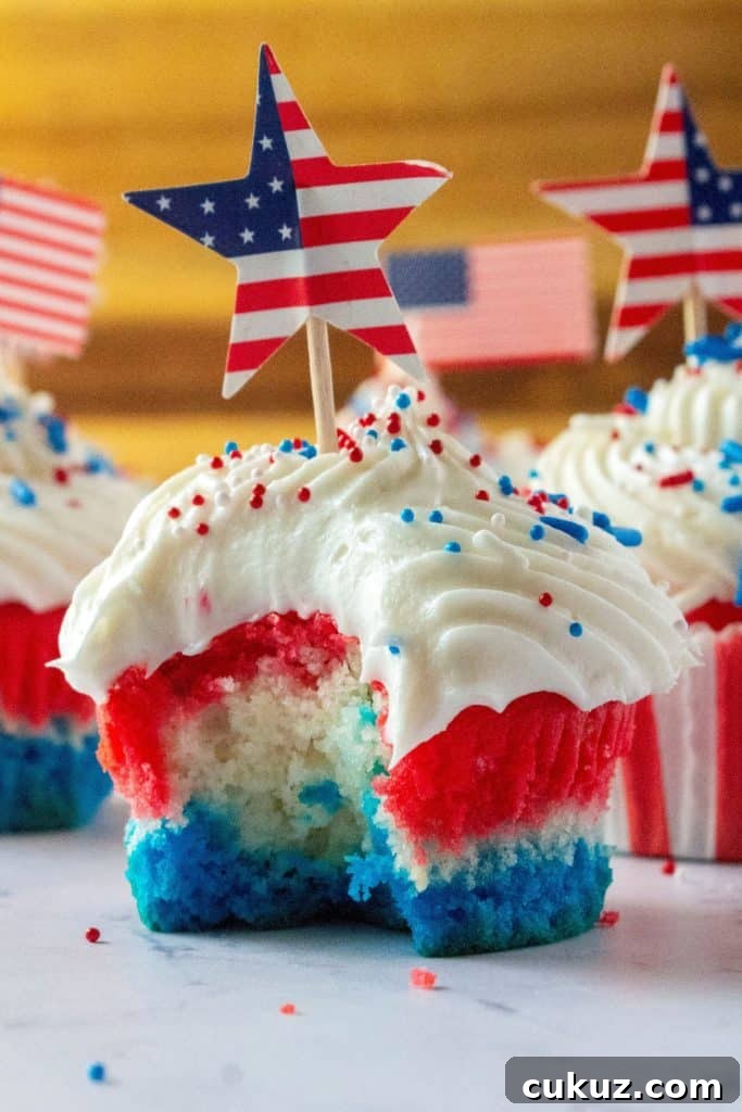 Red White and Blue Patriotic Cupcakes are the perfect Fourth of July Cupcakes to show off your American pride. Red, white and blue layered cupcakes topped with homemade buttercream frosting, these Red, White and Blue Patriotic Cupcakes will be the star of every Fourth of July dessert table.