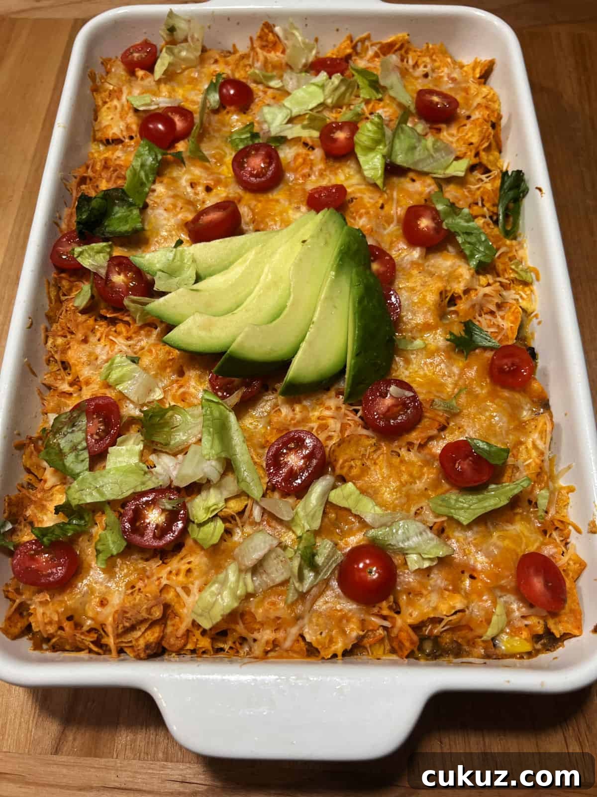 a pan of dorito casserole with ground beef.