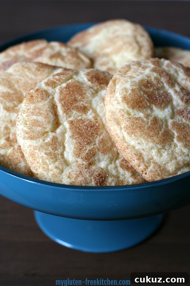 Several gluten free snickerdoodles in a blue bowl. 