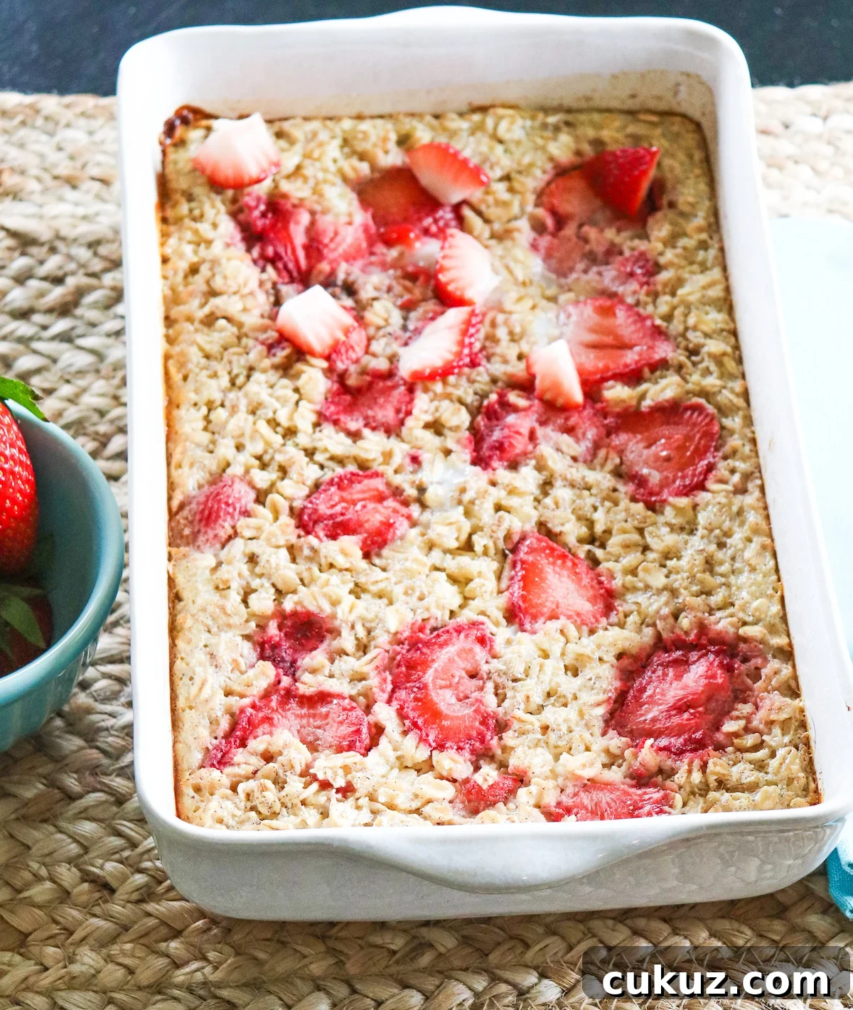 white dish of strawberry baked oatmeal