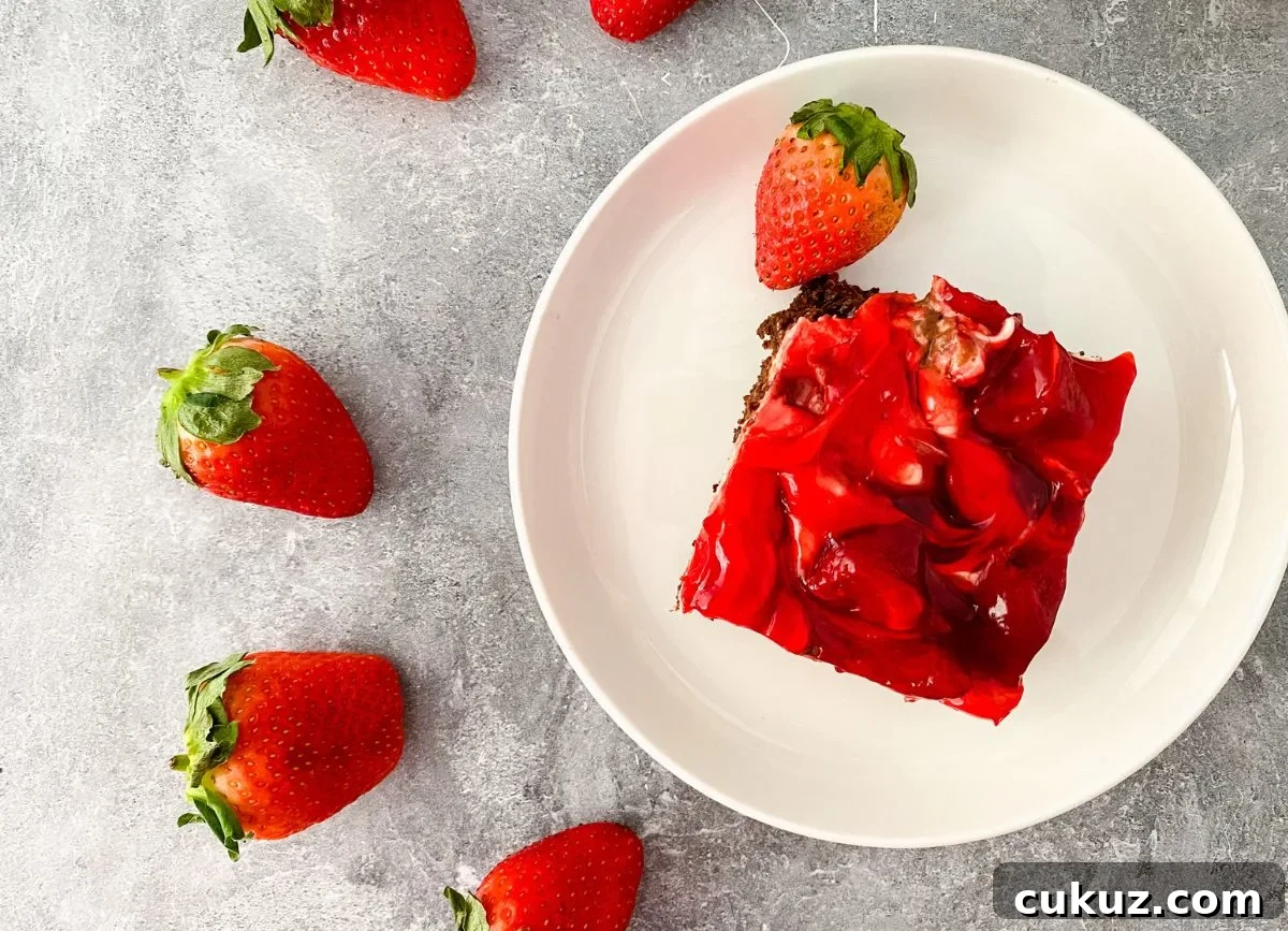 Looking down on a serving of dairy free strawberry cheesecake brownie.