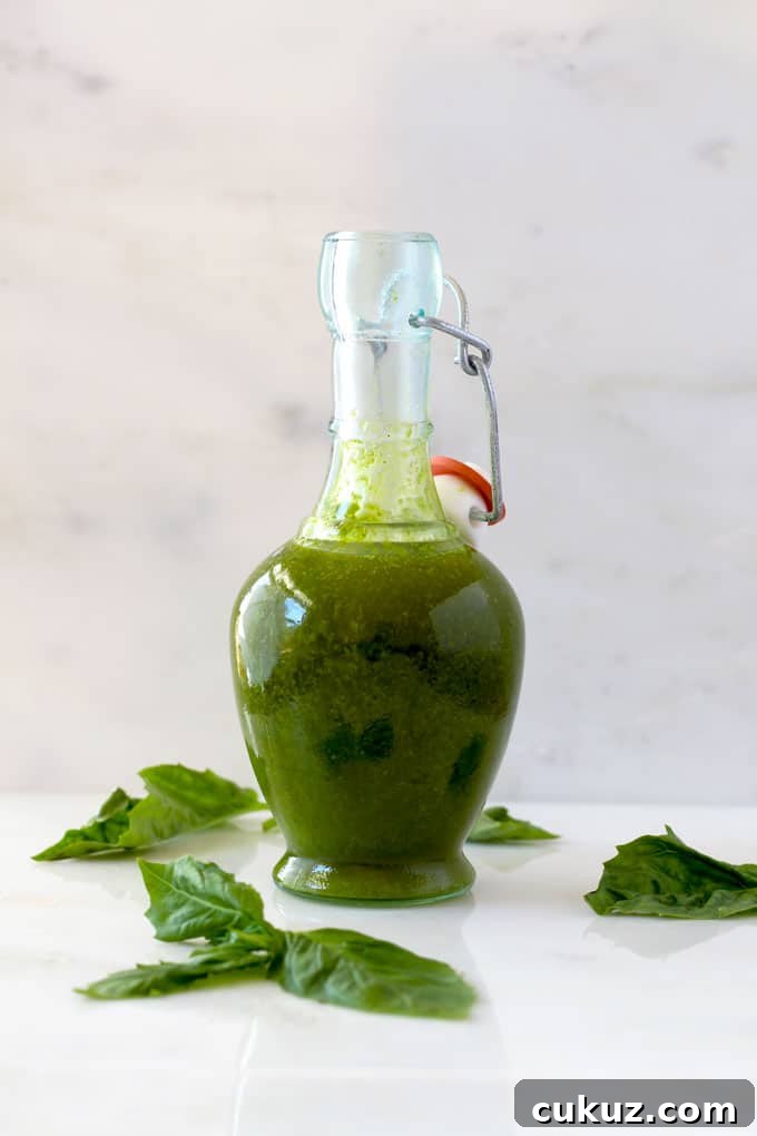 Basil Vinaigrette in a glass bottle.