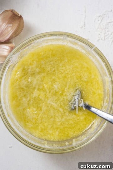 Pecorino lemon juice mix in a bowl whisked with a fork.