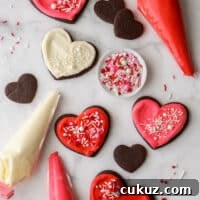 frosted sugar cookies with piping bags and sprinkles