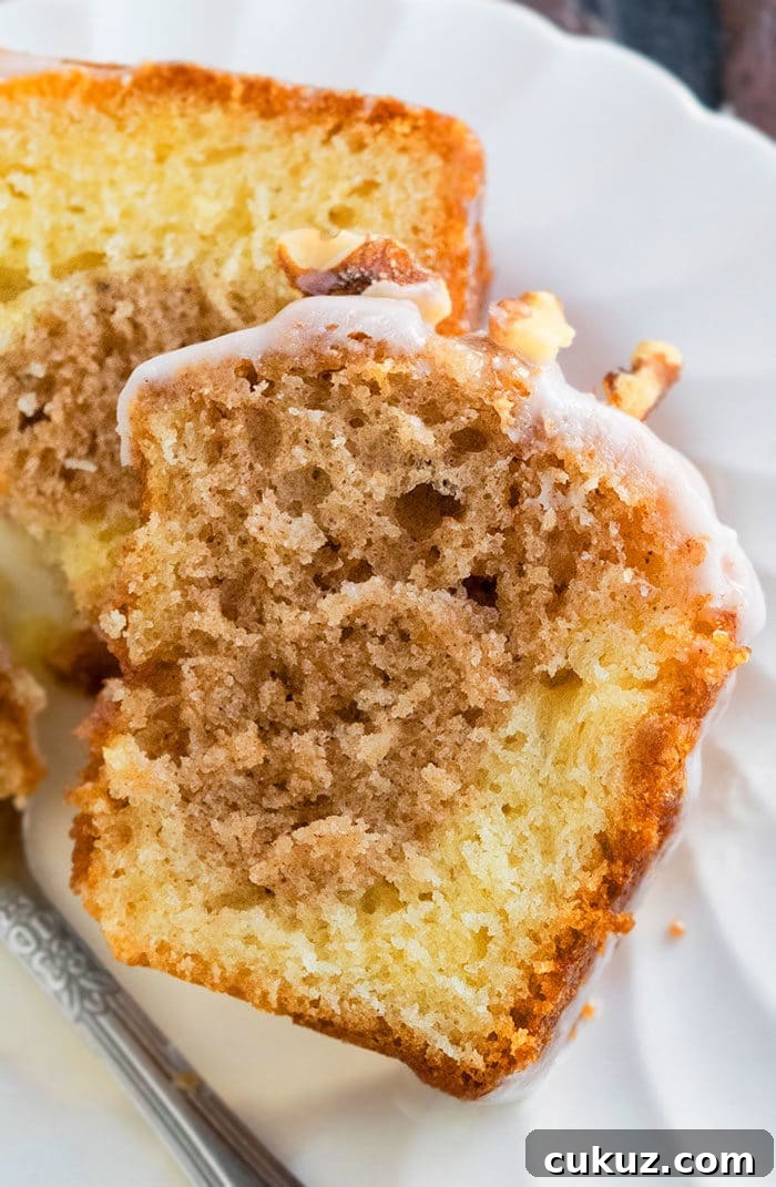 Slice of Homemade Sock It To Me Cake on White Dish