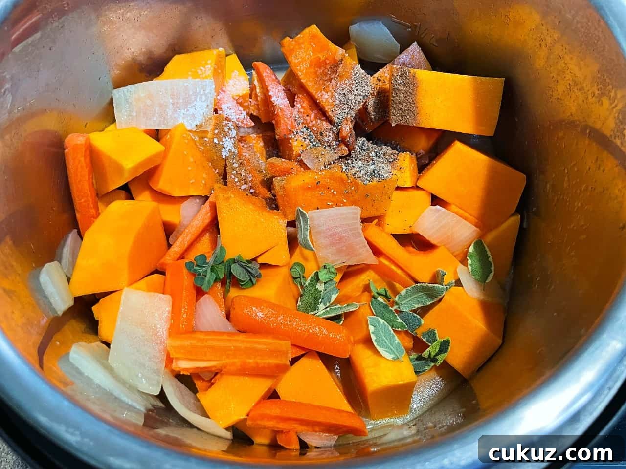 butternut squash soup ingredients in an electric pressure cooker.