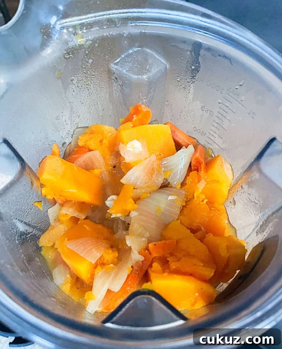 cooked butternut squash ingredients in a blender.