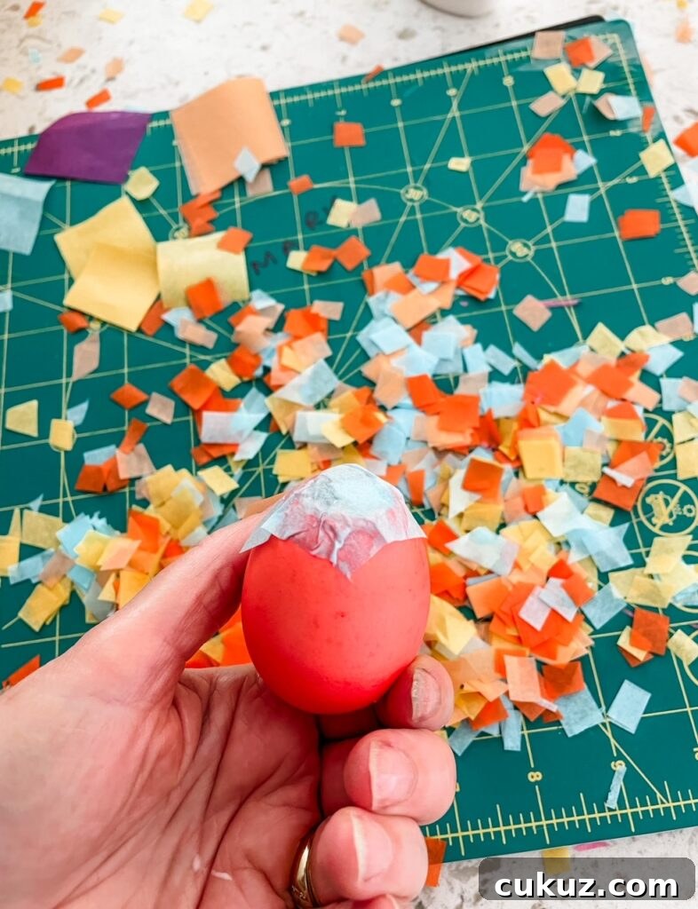 One of the DIY Confetti Easter Eggs being held up