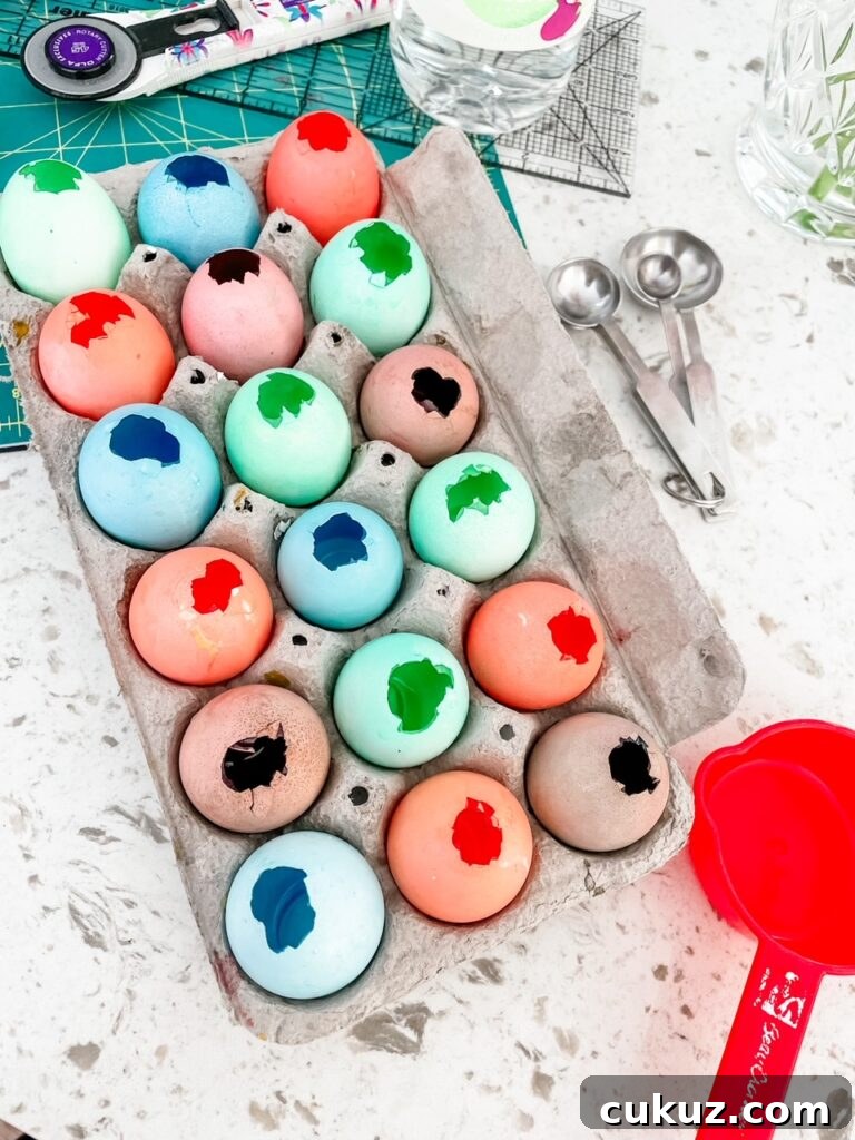 The empty, dyed eggshells drying in an egg cartoon