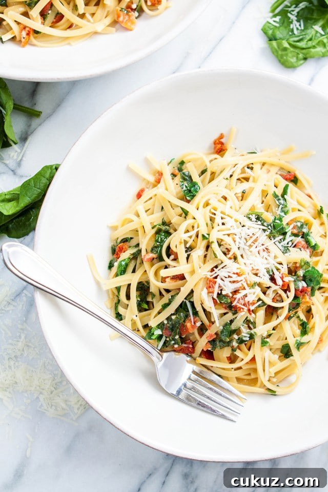 large bowl of sun dried tomato and spinach pasta 