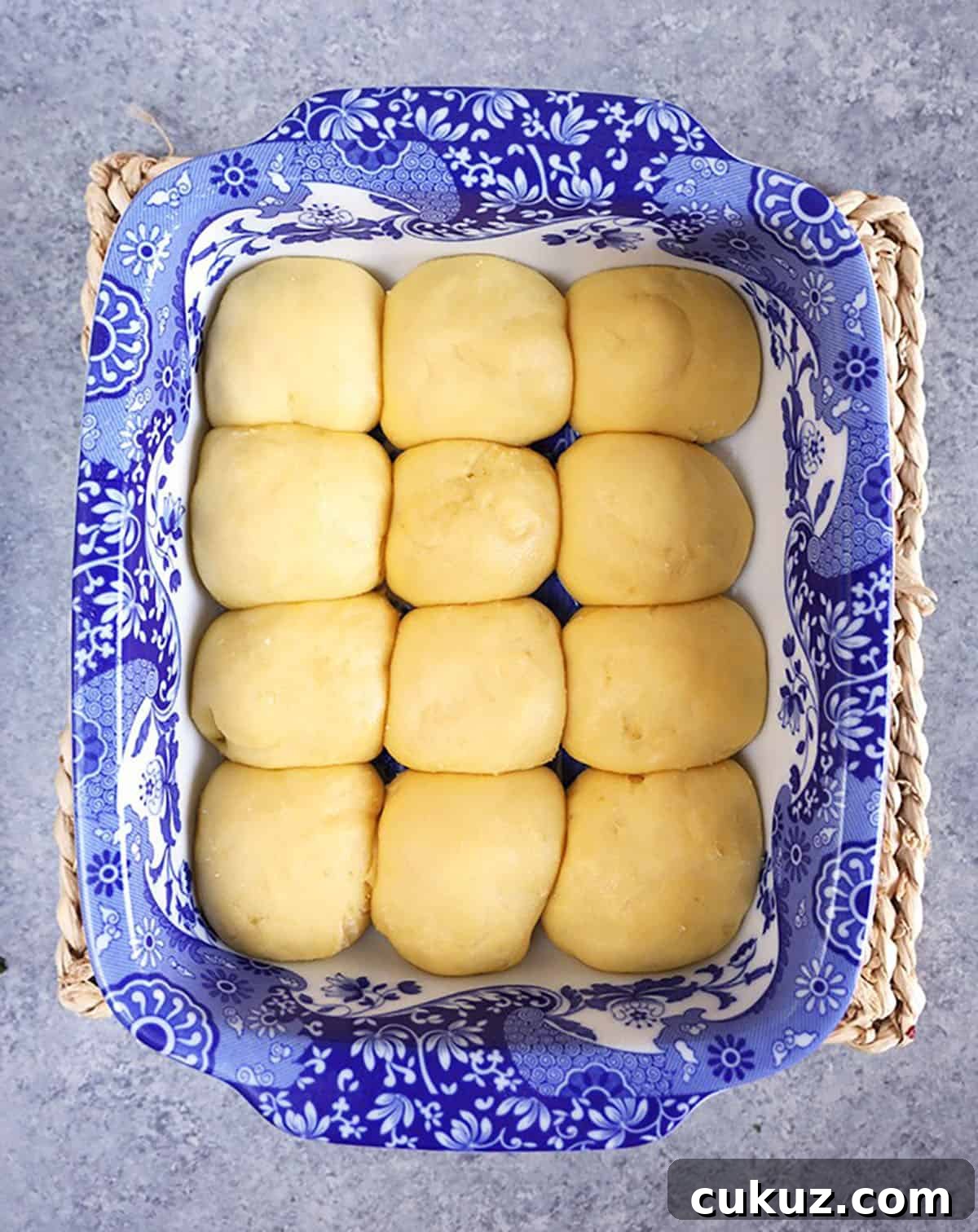 Dinner rolls in a baking dish before baking.