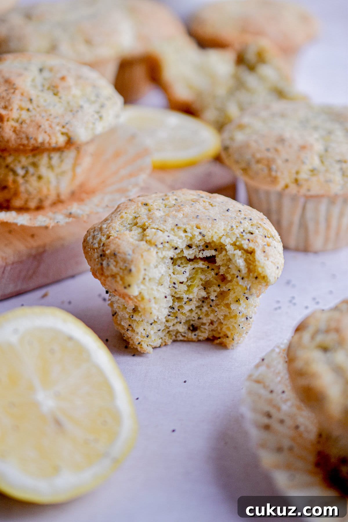Bread Flour vs. All-Purpose Flour: Key Differences You Should Know 3 A bite of a lemon poppyseed muffin is taken out of the muffin.