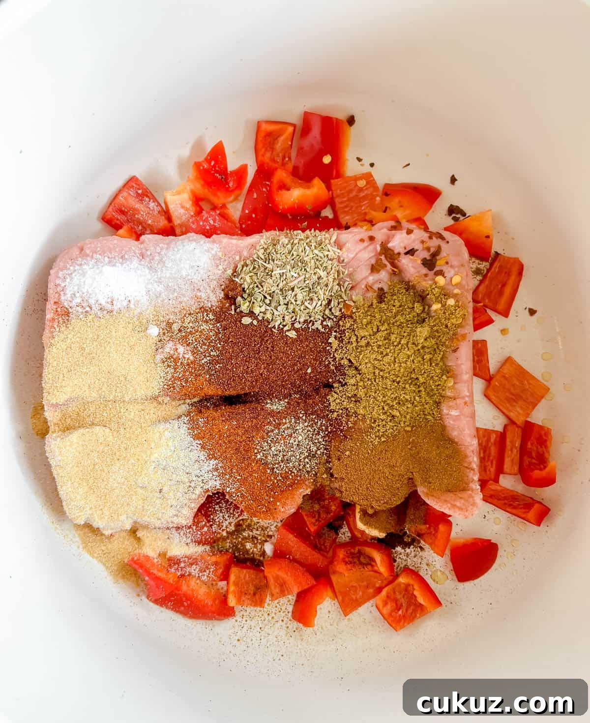 Ground turkey and spices added to the pan.