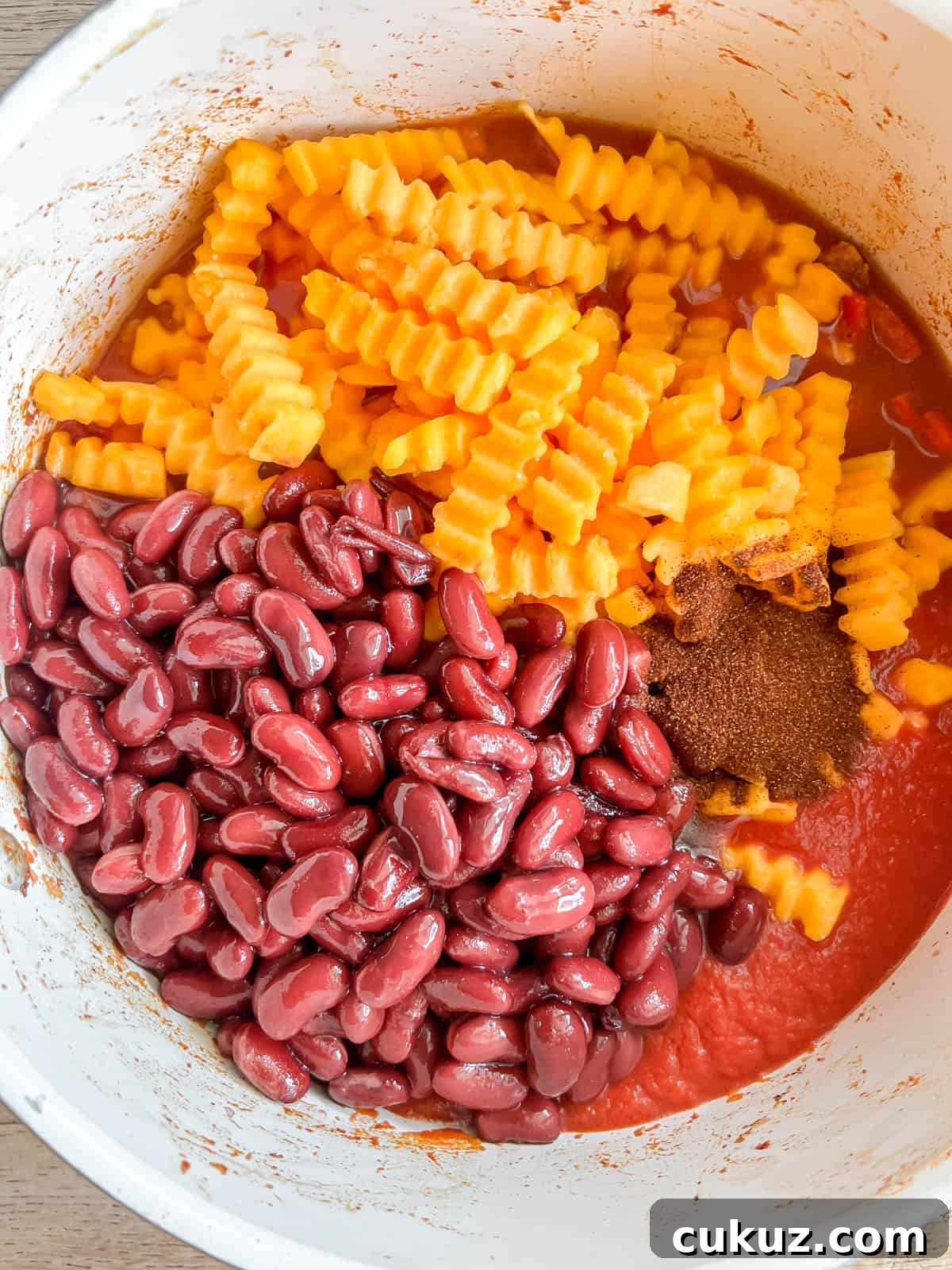 Beans and butternut squash added to the pan.