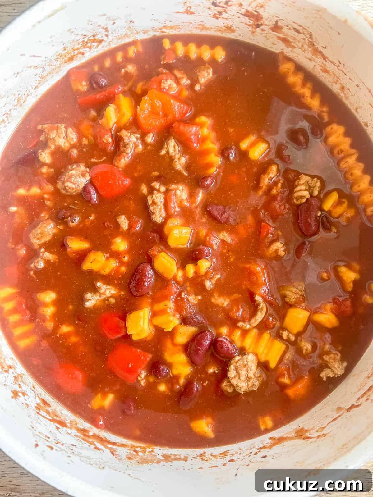 Tomato sauce added to the pan.