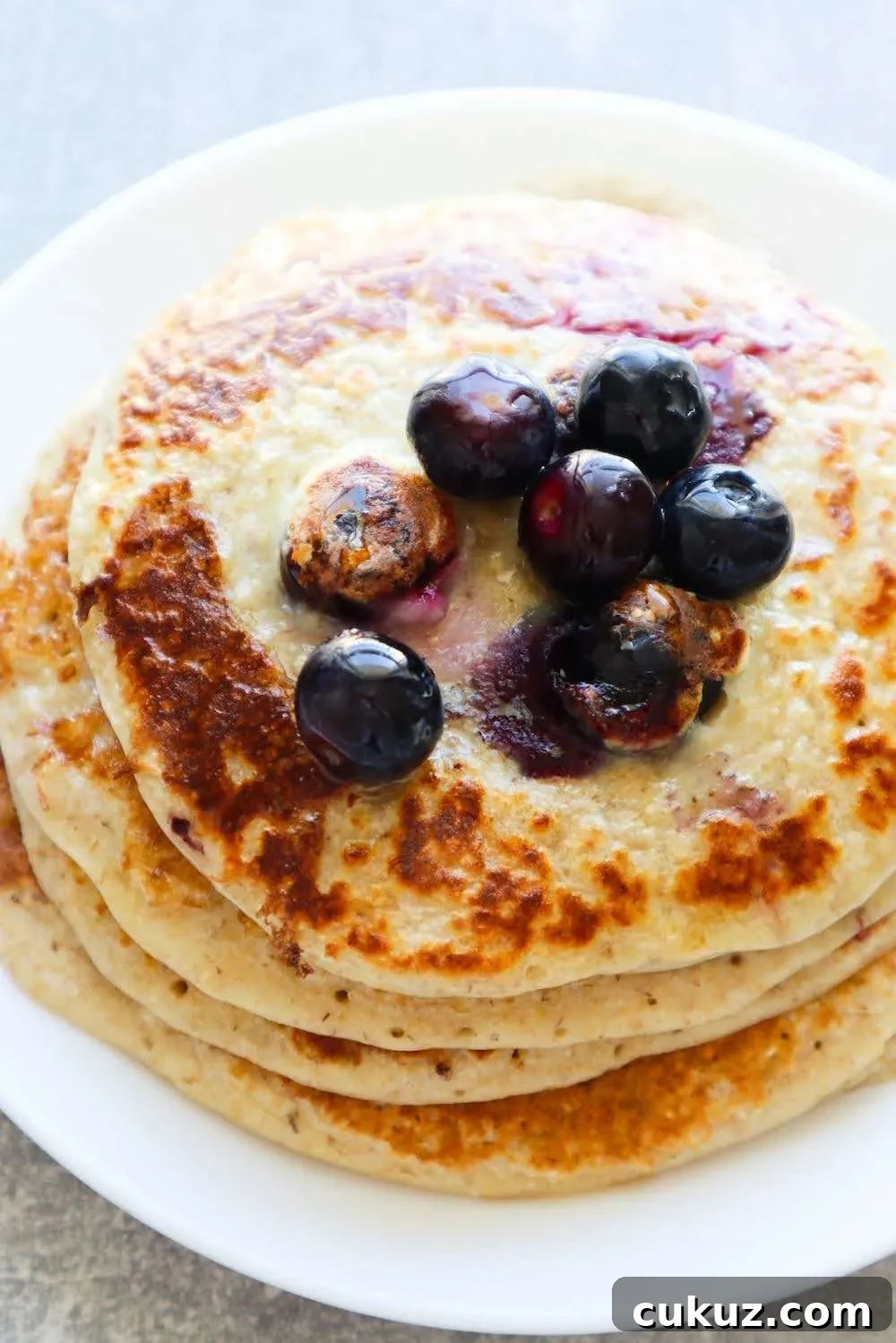 These flourless blueberry oatmeal pancakes are so so delicious! They make a quick and easy healthy breakfast that is kid-friendly too, my toddler loved these! If you're organized you can make the pancakes in about 10-15 minutes. You need 6 simple ingredients and this healthy pancake recipe is made without banana and flour.