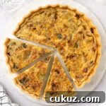 Close up on the quiche seen from above with 3 slices cut out.