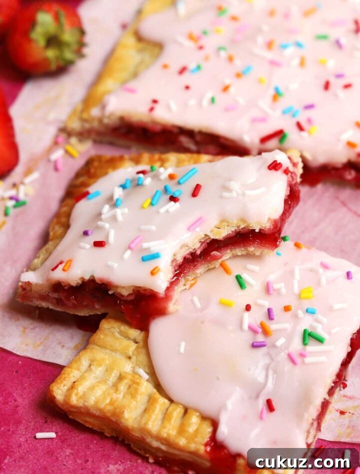 How to Make a Giant Frosted Strawberry Pop-Tart at Home 5 giant strawberry pop tart with bite
