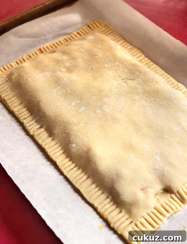 How to Make a Giant Frosted Strawberry Pop-Tart at Home 7 giant strawberry pop tart before baking