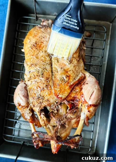 Brushing the duck with fat