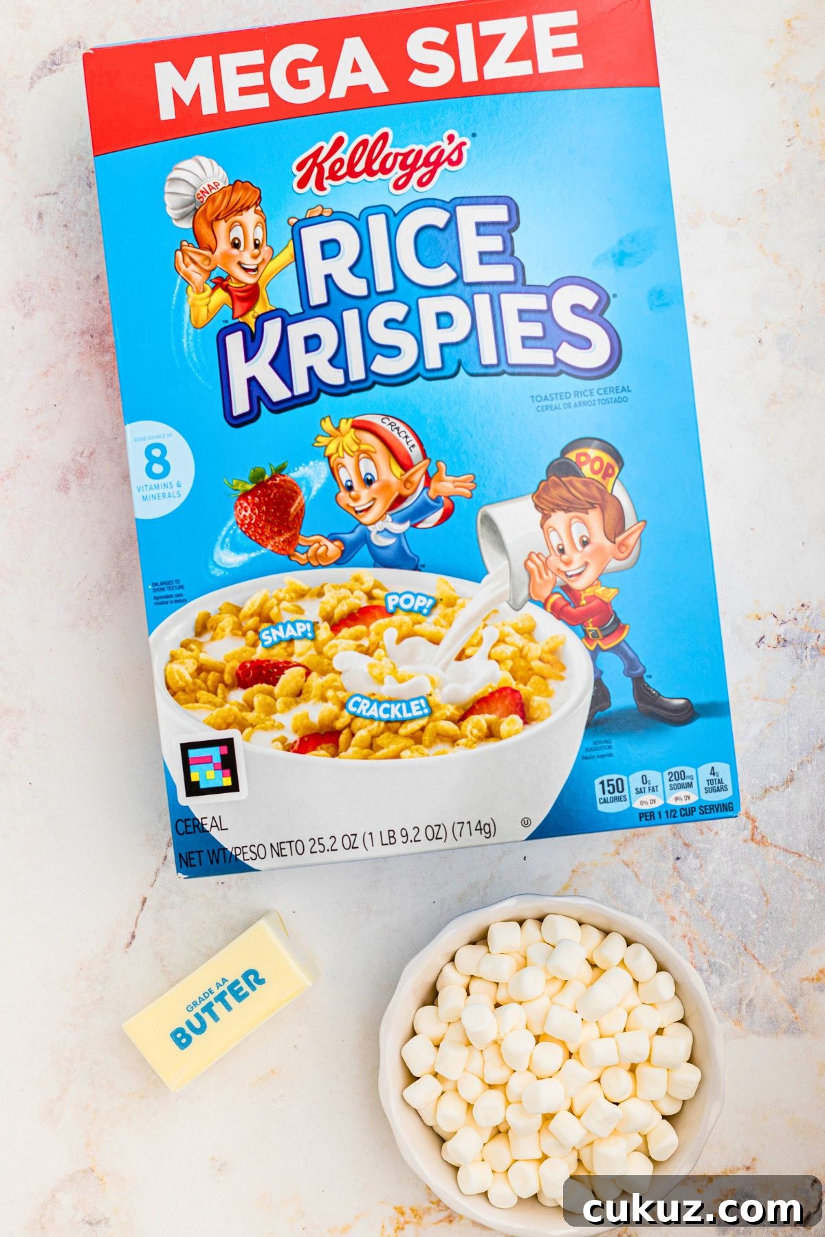 Ingredients needed to make rice krispie treats on a marble table. 