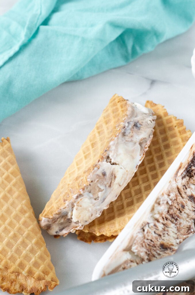 a waffle cone shell with ice cream in it showing how to make choco tacos