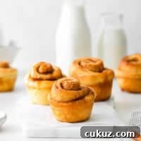 Cinnamon Roll Muffins: Soft Swirl Muffin Recipe with Cream Cheese Glaze 4 featured cinnamon roll muffins.