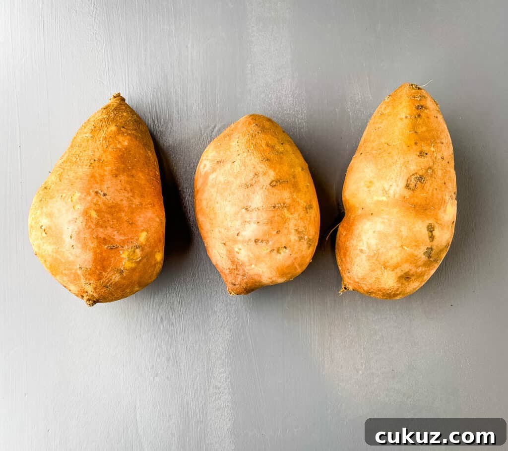 raw sweet potatoes on a flat surface
