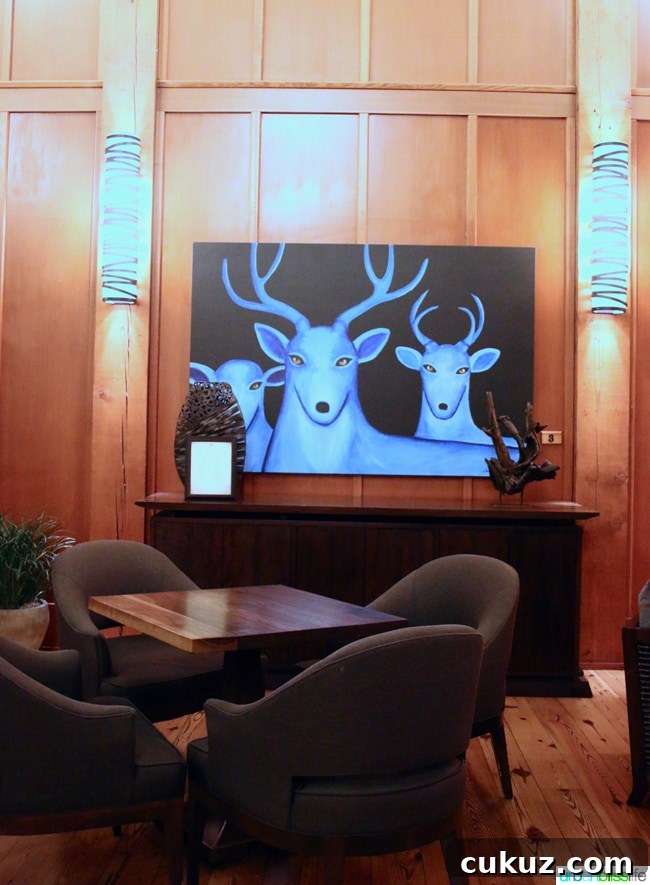 Skamania Lodge Washington lobby painting. Travel stories & hotel reviews on UrbanBlissLife.com