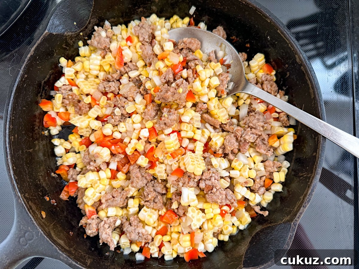 Sausage and Corn Pie with Quick Press‑In Pan Crust 7 cooking filling in cast iron skillet